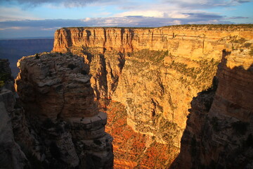 A stratification wall during a orange sunrise in the Grand Canyon National Park