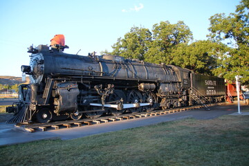 Naklejka premium The black steam locomotive on the Route 66 at Kingman
