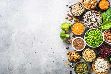Vegan protein source. Legumes, beans, lentils, nuts, broccoli, spinach and seeds. Top view with copy space. Healthy vegetarian food. - obrazy, fototapety, plakaty