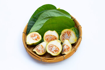 Chewing betel nut with betel leaves in bamboo basket