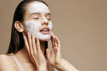 woman applying a soothing face mask cosmetic close-up make-up