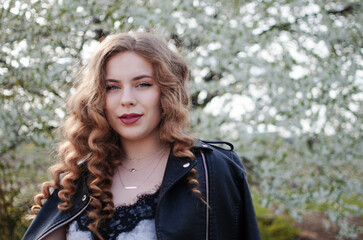 Happy girl with long hair walking in the spring