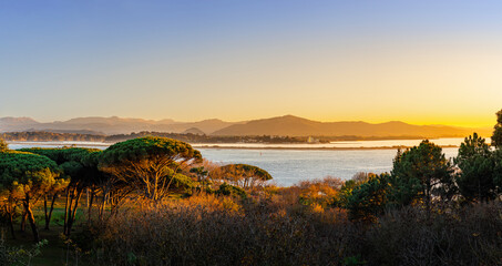 Stunning panoramic views of the fantastic evening light in Santander Bay. View from the Magdalena Peninsula to the Cantabrian Mountains. Santander, Cantabria, Spain.