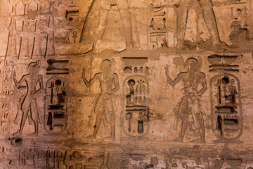 Naklejka premium Hieroglyphs in Medinet Habu (Mortuary temple of Ramesses III) at the Theban Necropolis, Egypt