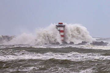 Storm Corrie Netherlands hitting lighthouse in IJmuiden, Netherlands
