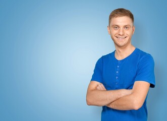 Portrait of attractive glad cheerful man demonstrating ad copy space