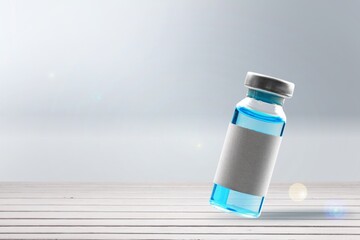 COVID-19 VACCINE for new strain. Ampoule on an abstract light background. Concept new variant of coronavirus