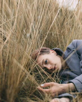 Beautiful girl is resting in nature. autumn day