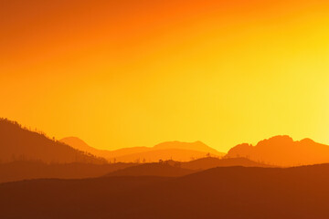 sunset over the mountains with copy space no people