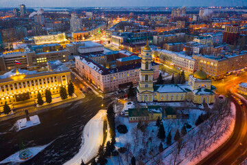 View from drone of illuminated Cathedral of Nativity of Christ on main square in Russian city of Lipetsk on winter evening..