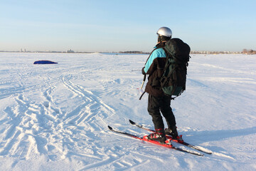 Man raising kite on the snow, Ob reservoir, Novosibirsk, Russia