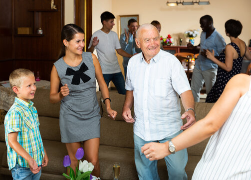 Grand family party - dancing in room at home. High quality photo
