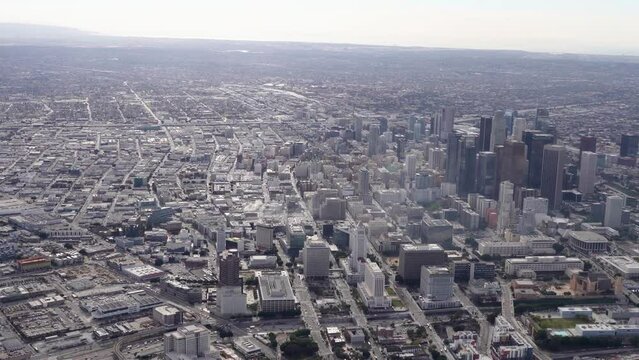 Aerial view of Downtown Los Angeles looking south Los Angeles City Hall and Grand Park visible in the foreground and the Port of Los Angeles and Port of Long Beach visible in the background