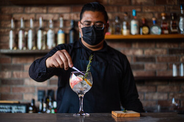 Bartender preparing a cocktail at the bar