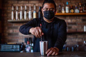 Bartender preparing a cocktail at the bar