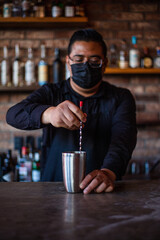 Bartender preparing a cocktail at the bar