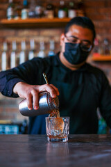 Bartender preparing a cocktail at the bar
