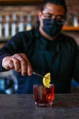 Bartender preparing a cocktail at the bar
