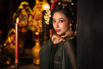 portrait of asian woman in traditional Chinese dress in Chinese shrine