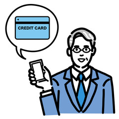 スマートフォンを持ってクレジットカードの説明をしているスーツを着たメガネをかけた中年男性
