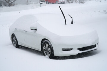 close up on snow covered car in winter