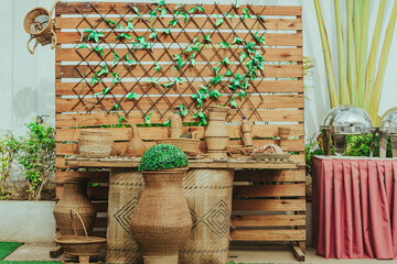 african decor involving green flowers and golden decor woods