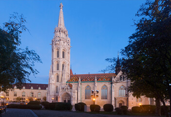 Fototapeta na wymiar Lush Gothic architecture of Matthias Church on Buda hill in twilight, Hungary.