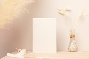 Blank paper card, greeting card mock up. decoration with dried Bunny Tail and pampas grass, Front...