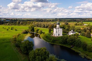 Fototapeta na wymiar Aerial drone view of medieval Church of Intercession on the Nerl in summer, Russia