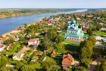 Scenic general aerial view of Russian town of Tutayev divided into two parts by Volga River overlooking Resurrection Cathedral on sunny summer day, Yaroslavl Oblast