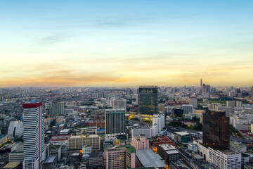 Aerial view of modern office buildings in Bangkok downtown with sunrise time, Bangkok, Thailand