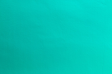 Green color with an old grunge wall concrete texture as a background.