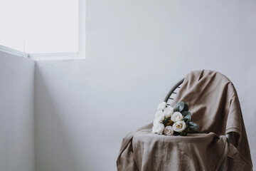 Bouquet of roses on beige fabric with copy space © Gatot