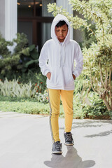 Hipster kid wearing a plain white hoodie for hoddie mock-up