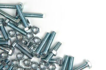 several silver metal bolts with nuts on a white background. close-up and copy space