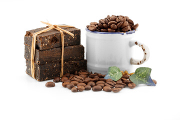 handmade flavored coffee soap and coffee beans on a white background