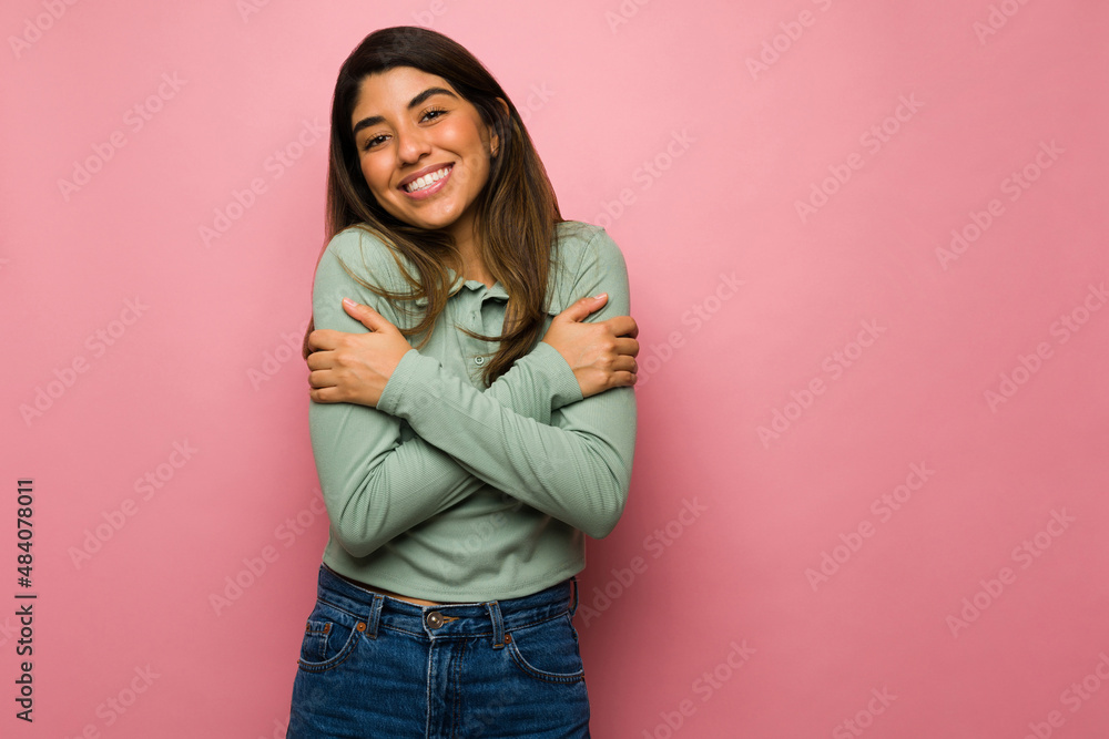 Wall mural loving woman embracing herself