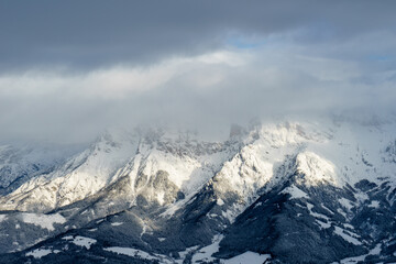 Naklejka premium Snow-capped mountains under a cloud cover - Hochkönig region - Salzburg, Austria