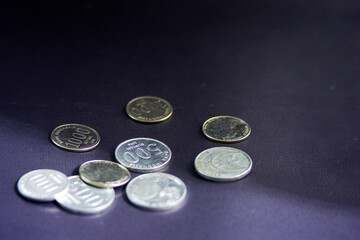 various Indonesian rupiah coins on a black background. Good for economy concept. Coin Illustration