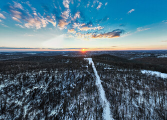 sunset landscape in the snowy mountains aerial