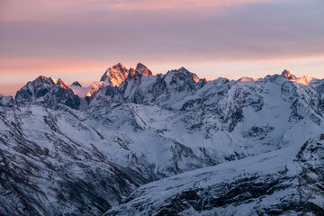 Snowy Greater Caucasus ridge. Mount. Ushba. Sunset. Panoramic view. Elbrus region, Kabardino-Balkaria, Russia