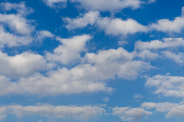 Puffy white clouds with blue sky