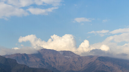 Fototapeta premium Scenery view of mountains with clouds and blue sky