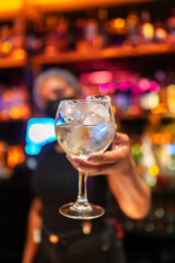 waitress serving a cocktail at her place
