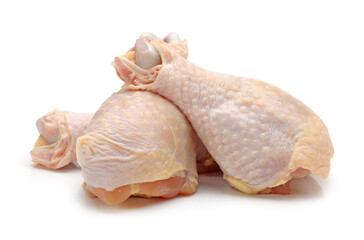 raw chicken legs on white.