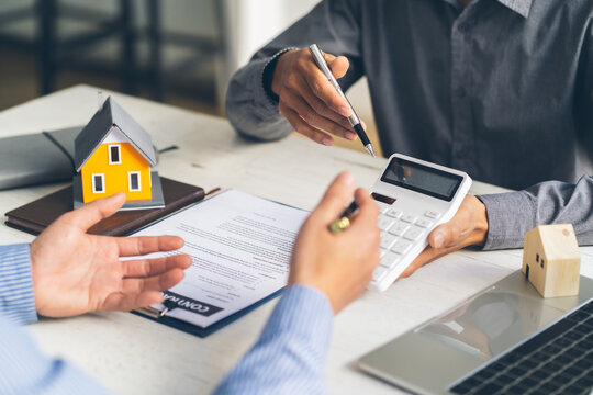 Real estate agent talked about the terms of the home purchase agreement and asked the customer to si