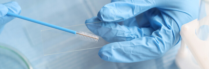 Taking vaginal smear from women on glass closeup