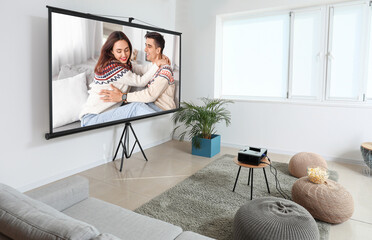 Scene of romantic movie on screen of video projector at home