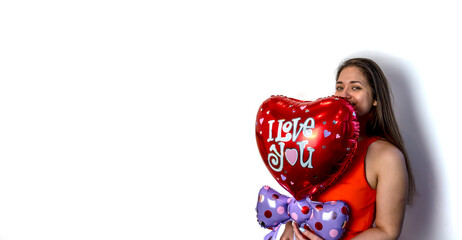 Fototapeta na wymiar Happy Valentine's day! Young woman with a balloon in the form of a heart. Copy Space.