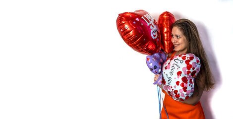 Happy Valentine's day! Young woman with a balloon in the form of a heart. Copy Space.